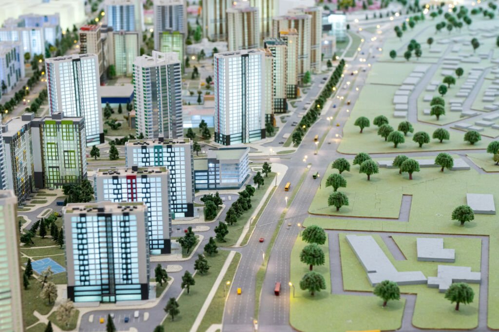 A miniature city on the table. The layout of the block for designing with a residential building. Layout of a residential development with a park.