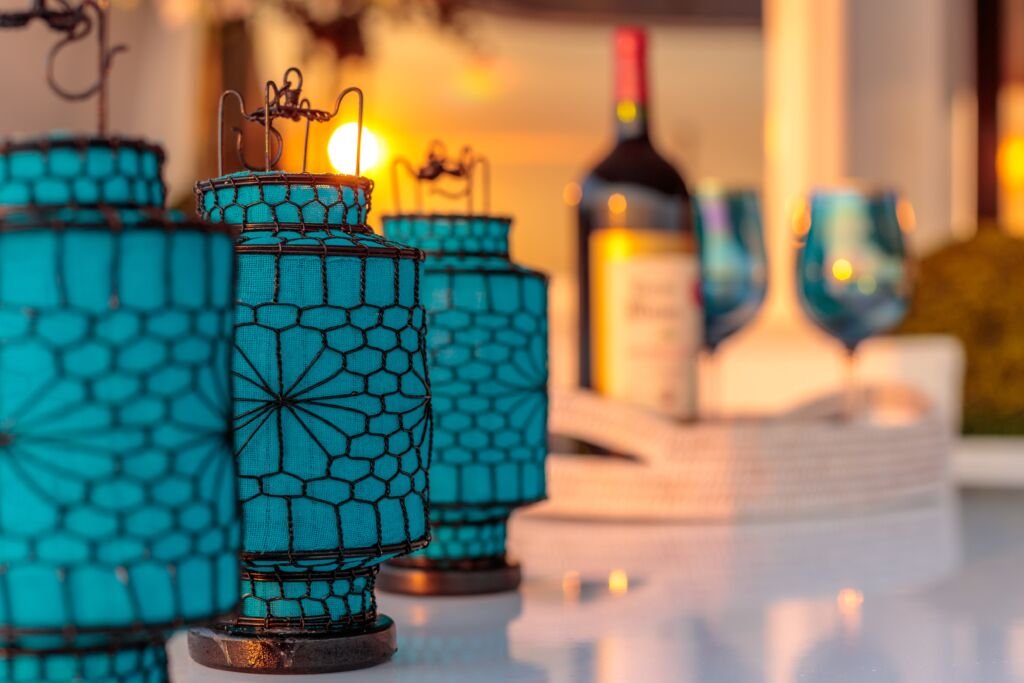 A closeup shot of blue lanterns with interesting textures on a blurred background.